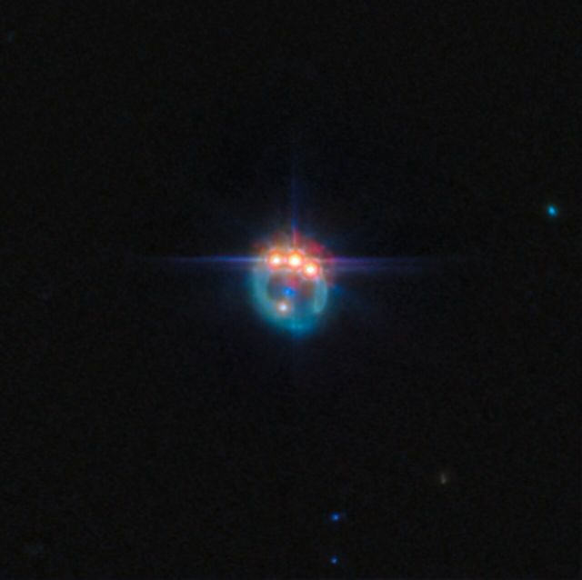 Space - Gravitational lens magnifies spinning black hole in distant quasar