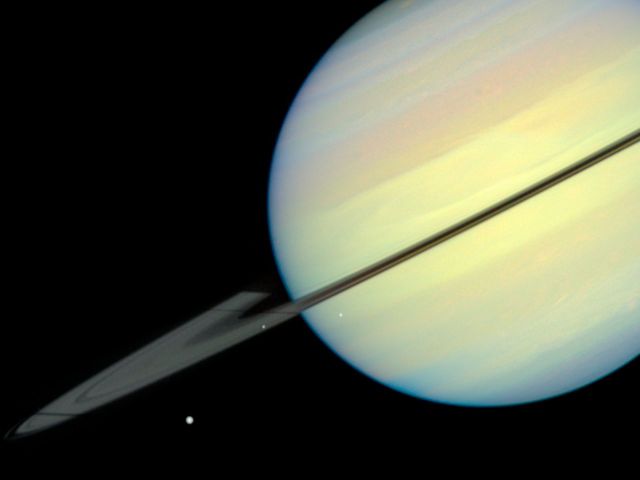 Space - Saturn: moons cast shadows during rare ring alignment