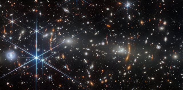 Space - Two massive galaxy clusters collide in cosmic construction site
