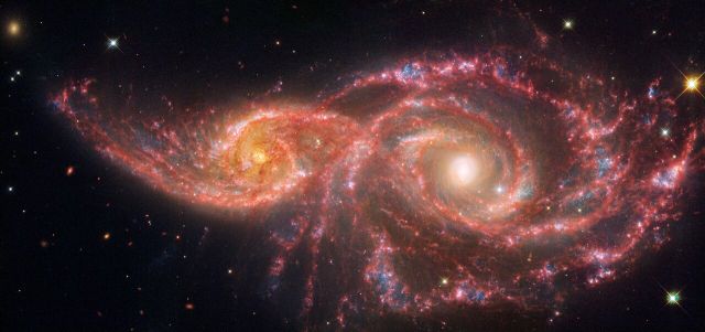 Space - IC 2163 and NGC 2207: Grazing spiral galaxies
