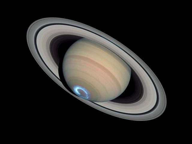 Space - Saturn's glowing polar lights reveal hidden atmospheric secrets